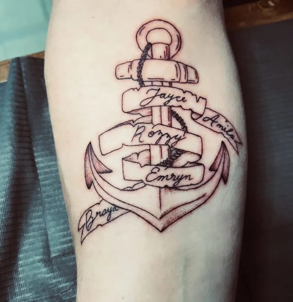 Anchor tattoo with ribbon names, symbolizing stability, strength, and elegance, representing grandchildren as anchors in the grandparent's life