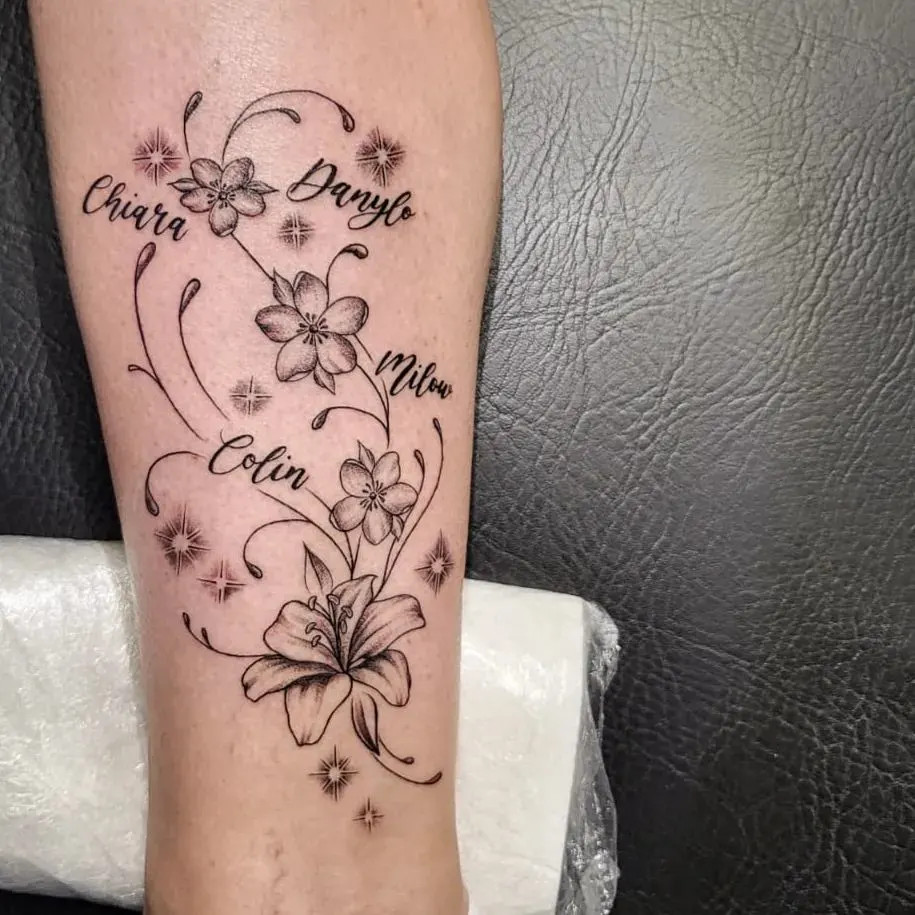 Floral design with names tattoo, symbolizing beauty and growth, celebrating grandchildren through nature's elegance