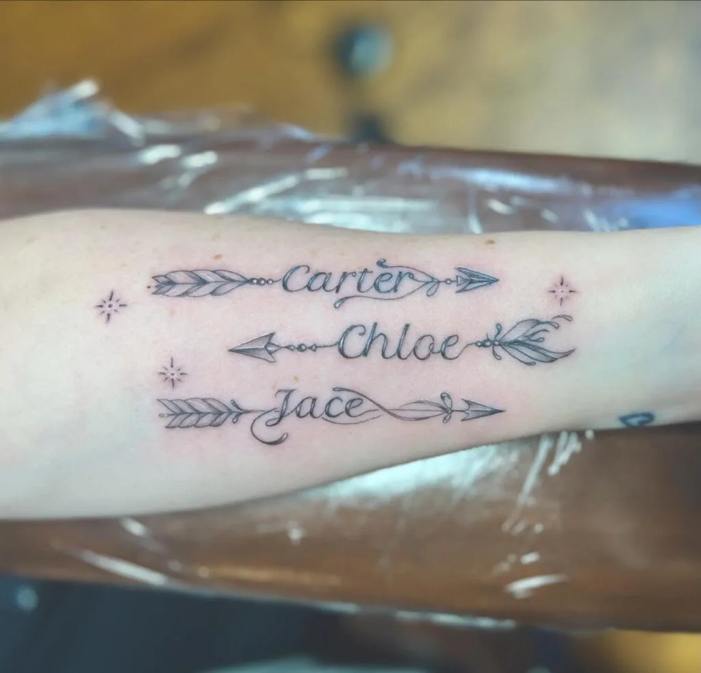 Arrows and stars tattoo with names, symbolizing direction, guidance, and hope, highlighting the importance of grandchildren in the grandparent's life journey