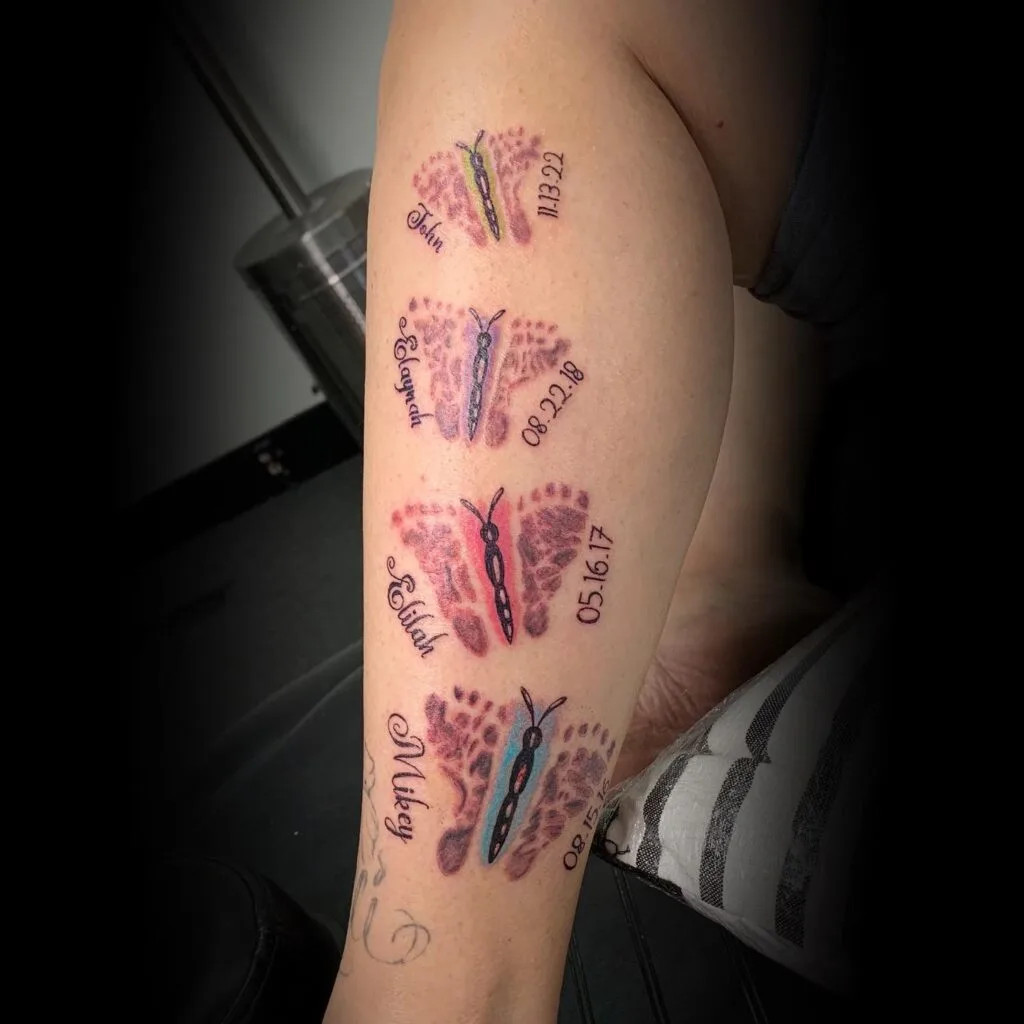 Butterflies with birthdates tattoo, symbolizing transformation and beauty with vibrant colors and names for each grandchild