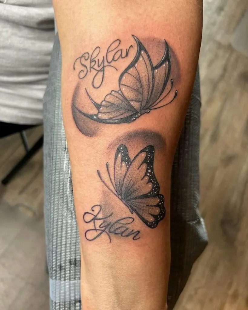 Butterfly name tattoo, showcasing elegant butterflies in flight with names, symbolizing joy and freedom associated with loved ones