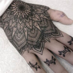 Detailed geometric hand tattoo for men