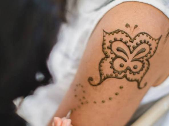 A collection of different henna designs on hands