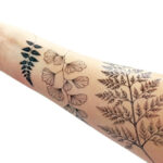 Woman applying a temporary tattoo to her arm after preparing the skin with alcohol
