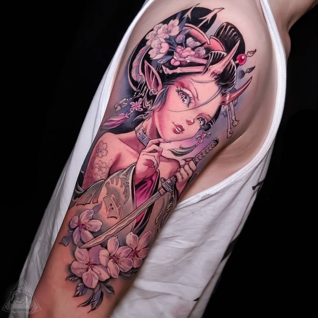 A geometric Japanese cherry blossom tattoo on the back of the neck.
