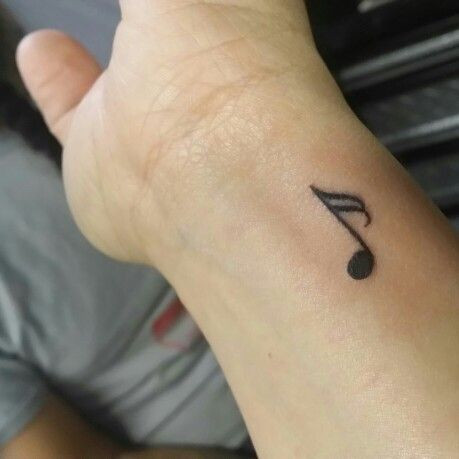 Music note wrist tattoo symbolizing passion for music