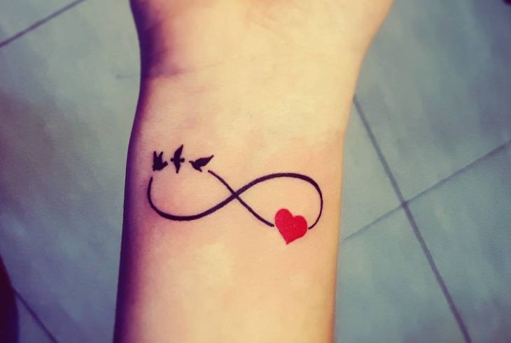Infinity heart wrist tattoo representing eternal love