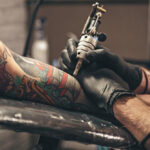 Close-up of tattoo ink being applied to skin