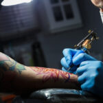 Close-up of a tattoo infection with redness and swelling