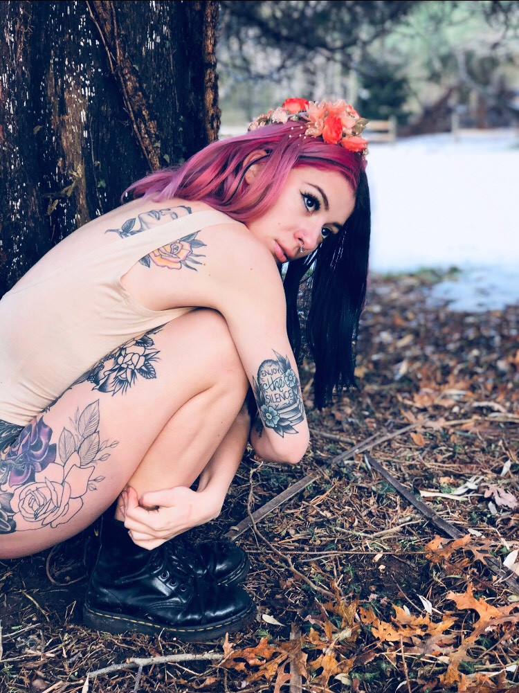 Alexis Lucena showcasing her arm tattoos