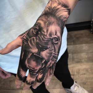 Hand tattoo with intricate details