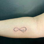 Wrist infinity tattoo with delicate line work