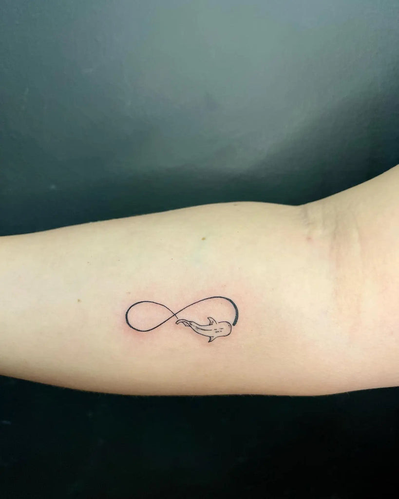 Wrist infinity tattoo with delicate line work