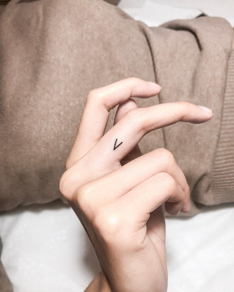 Petite__dino combines minimalist style with initial tattoo design