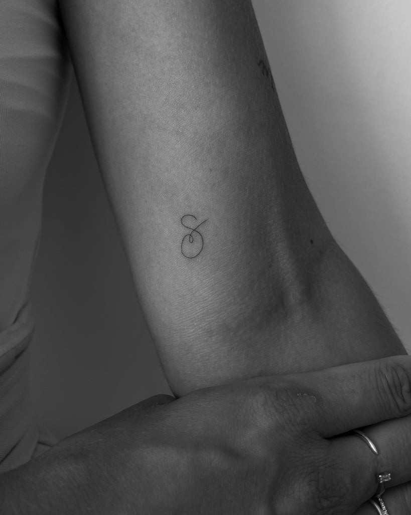 Combining initial tattoo with celestial elements