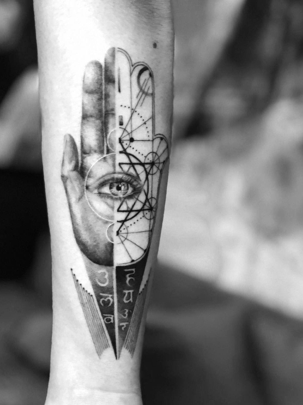 A Hamsa tattoo with vibrant colors and intricate details, symbolizing empowerment and cultural connection