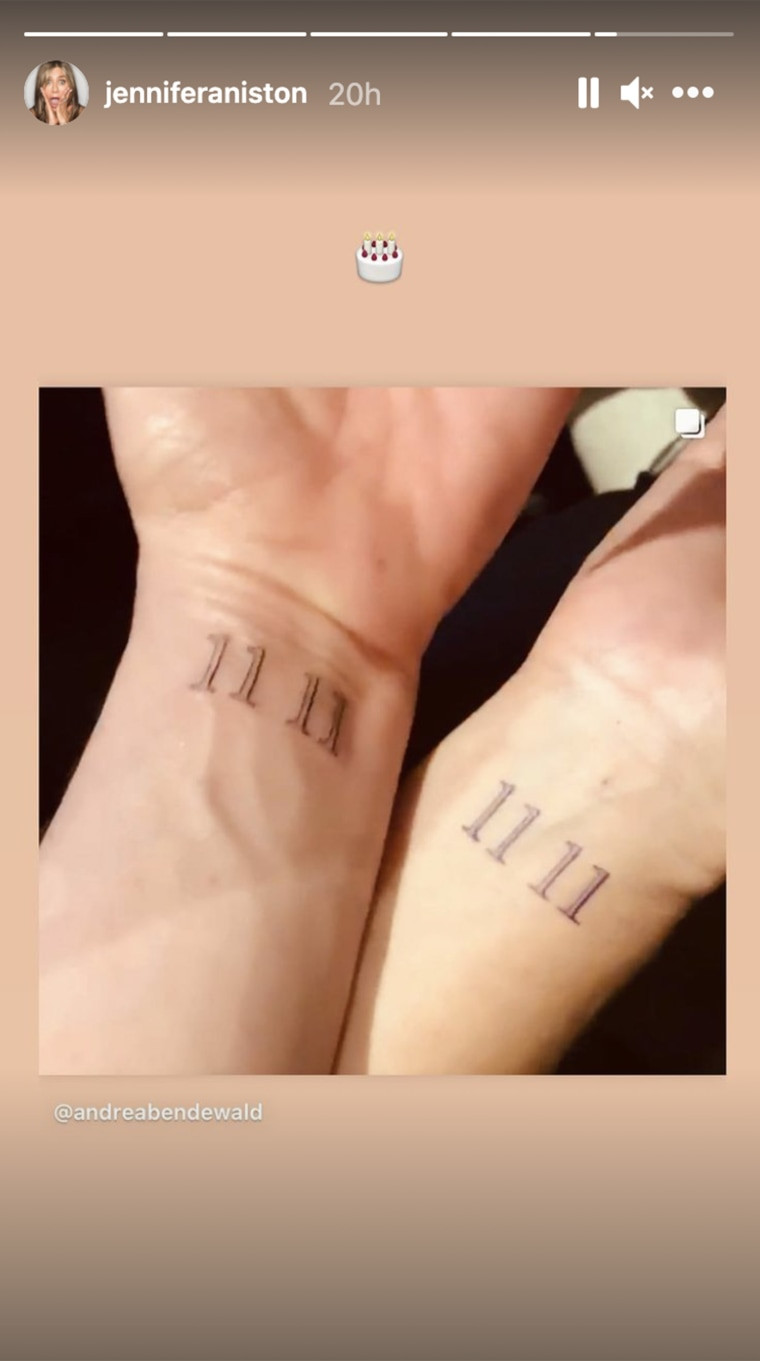 Jennifer Aniston displaying her 11 11 wrist tattoo, a simple yet meaningful design choice.