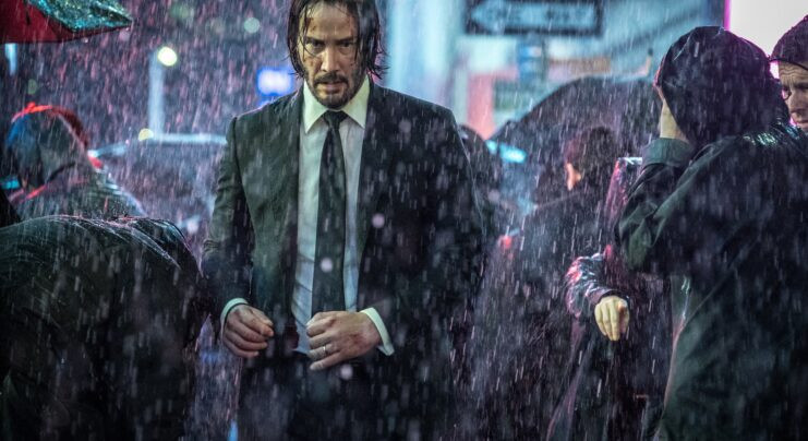 Fortis Fortuna Adiuvat tattoo on John Wick's back symbolizing his daring and resilient spirit