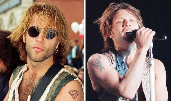 Jon Bon Jovi showing off his Superman and steer skull tattoos