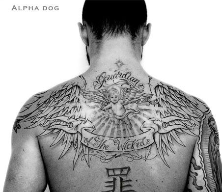 Justin Timberlake's back tattoo featuring a guardian angel with his mother's initials and the word Guardian, a tribute to his late sister.