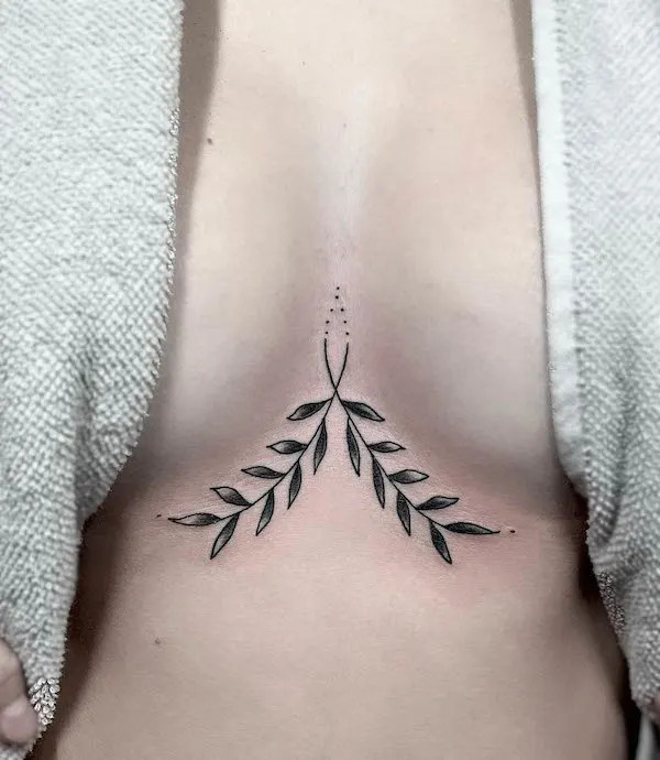 Simple symmetrical leaves creating balance under the breast.