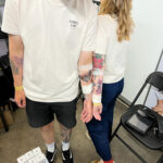 Two people tattooed at Leeds Tattoo Expo