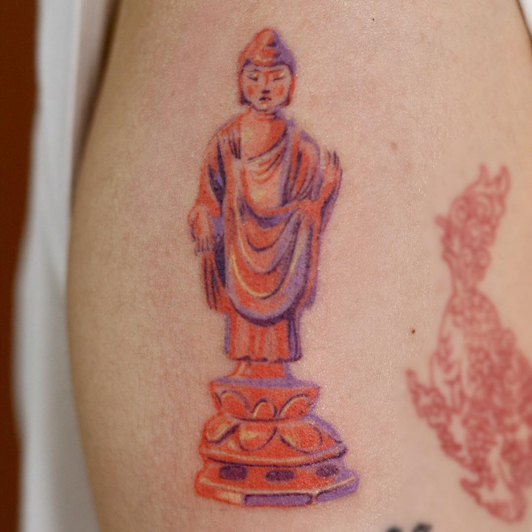 A collage of various Buddha tattoos, showing different styles and placements