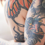 Close-up of a raised tattoo line, highlighting the scar tissue