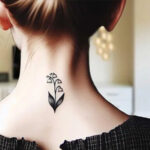 Minimalist Lily of the Valley tattoo on the inner arm