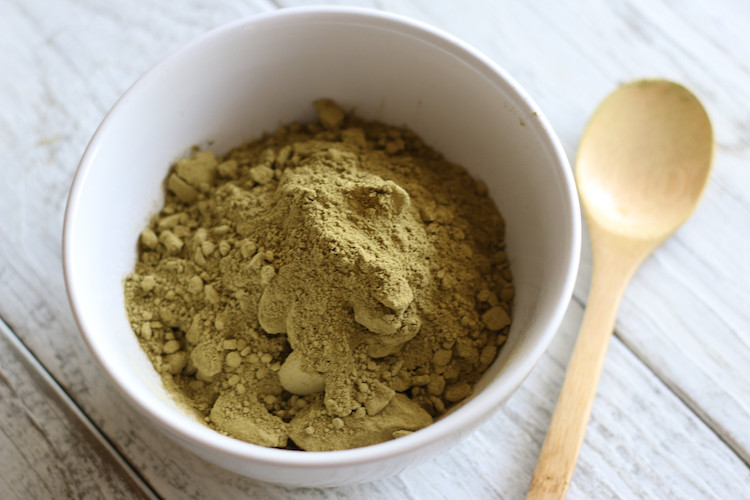 Henna tattoo paste ingredients including henna powder, lemon juice, sugar, and essential oils.