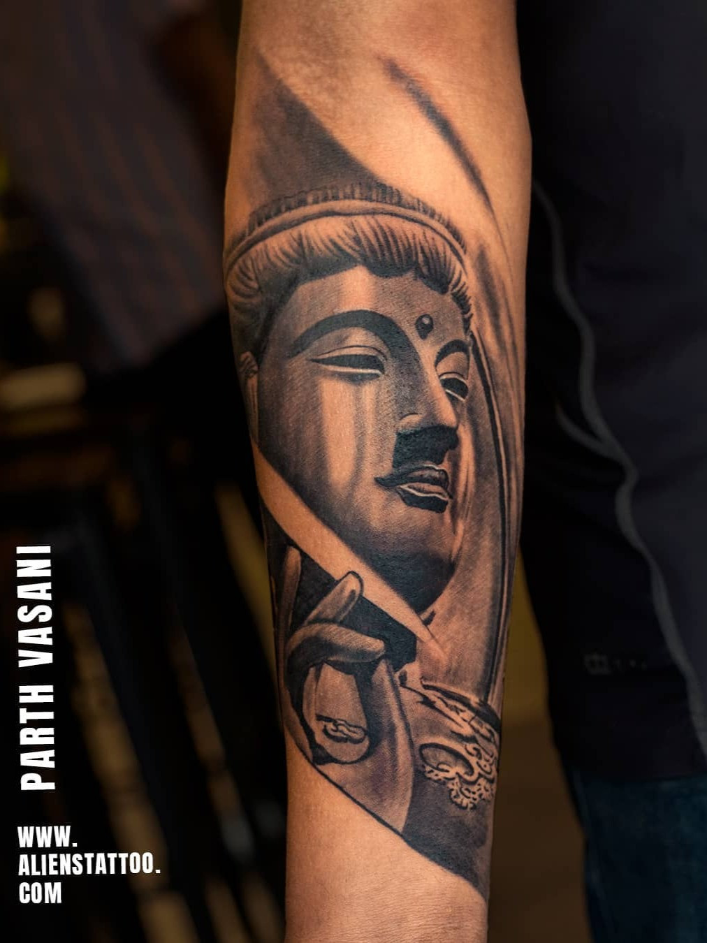 A simple Buddha head tattoo with intricate detail