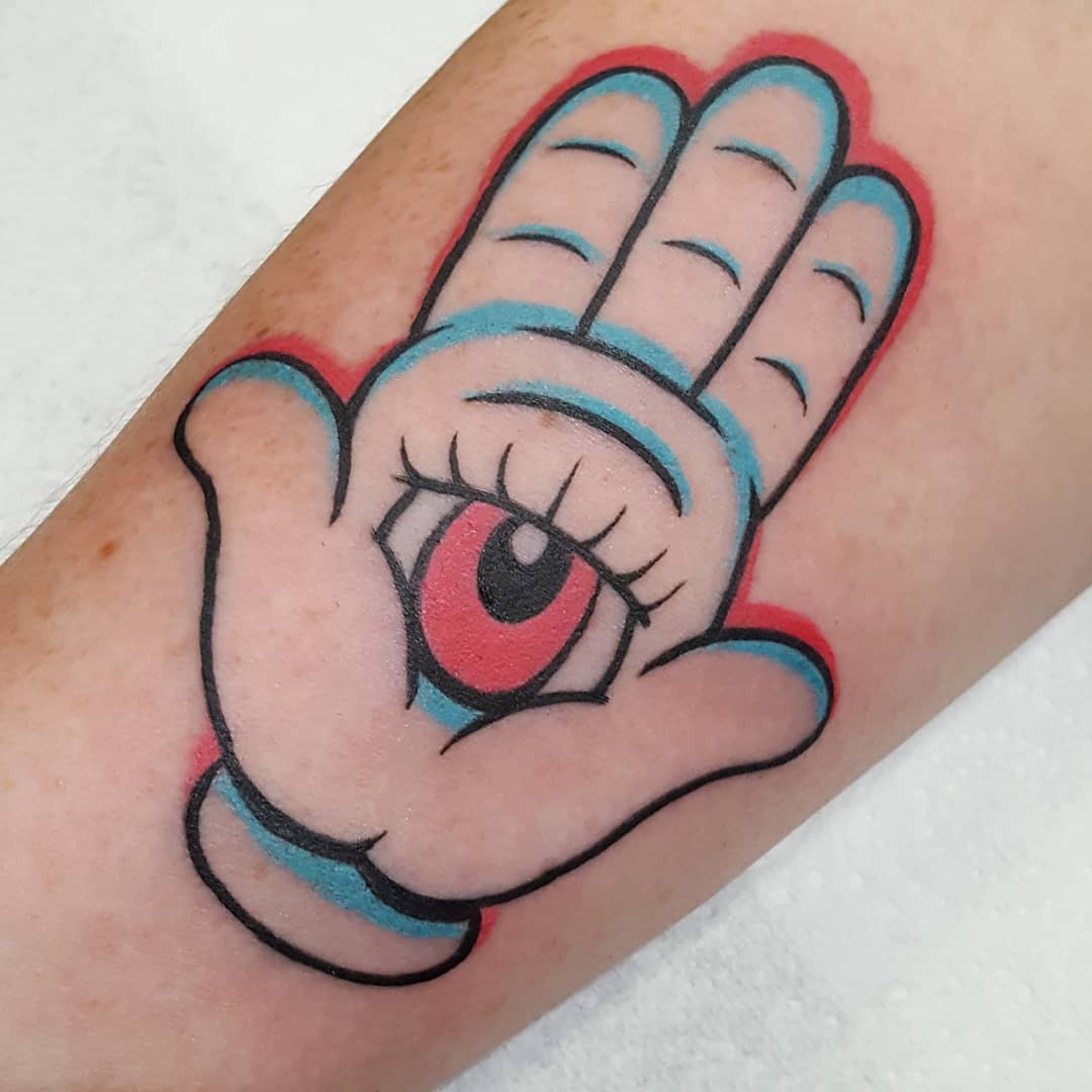 A Hamsa tattoo on the wrist, symbolizing constant protection and serving as a daily reminder