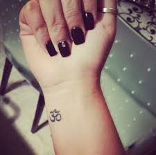 Om tattoo to represent the four states of consciousness