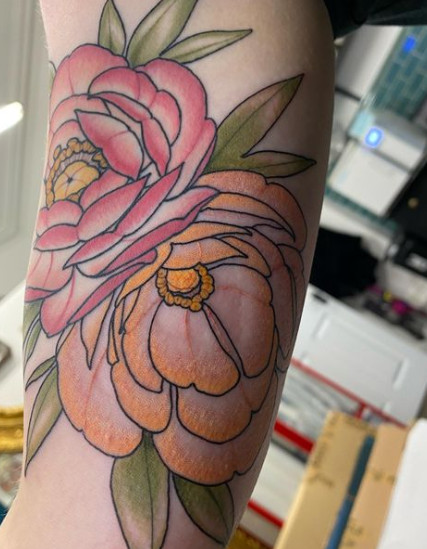 Arm tattoo of colorful flower and butterflies