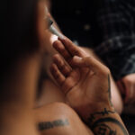 A woman putting vaseline on a tattoo.