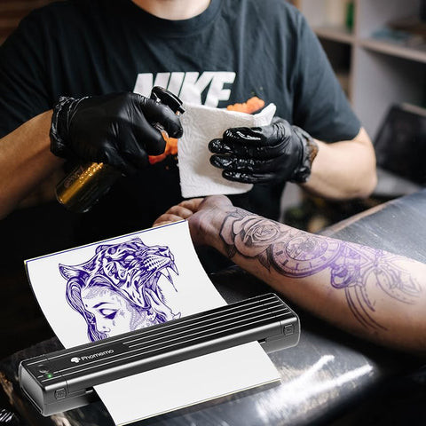 Phomemo stencil printer used in a professional tattoo environment, demonstrating clear stencil printing