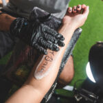 Forearm tattoo inspiration, featuring a detailed floral design wrapping around the arm