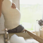 Pregnant woman with visible tattoo