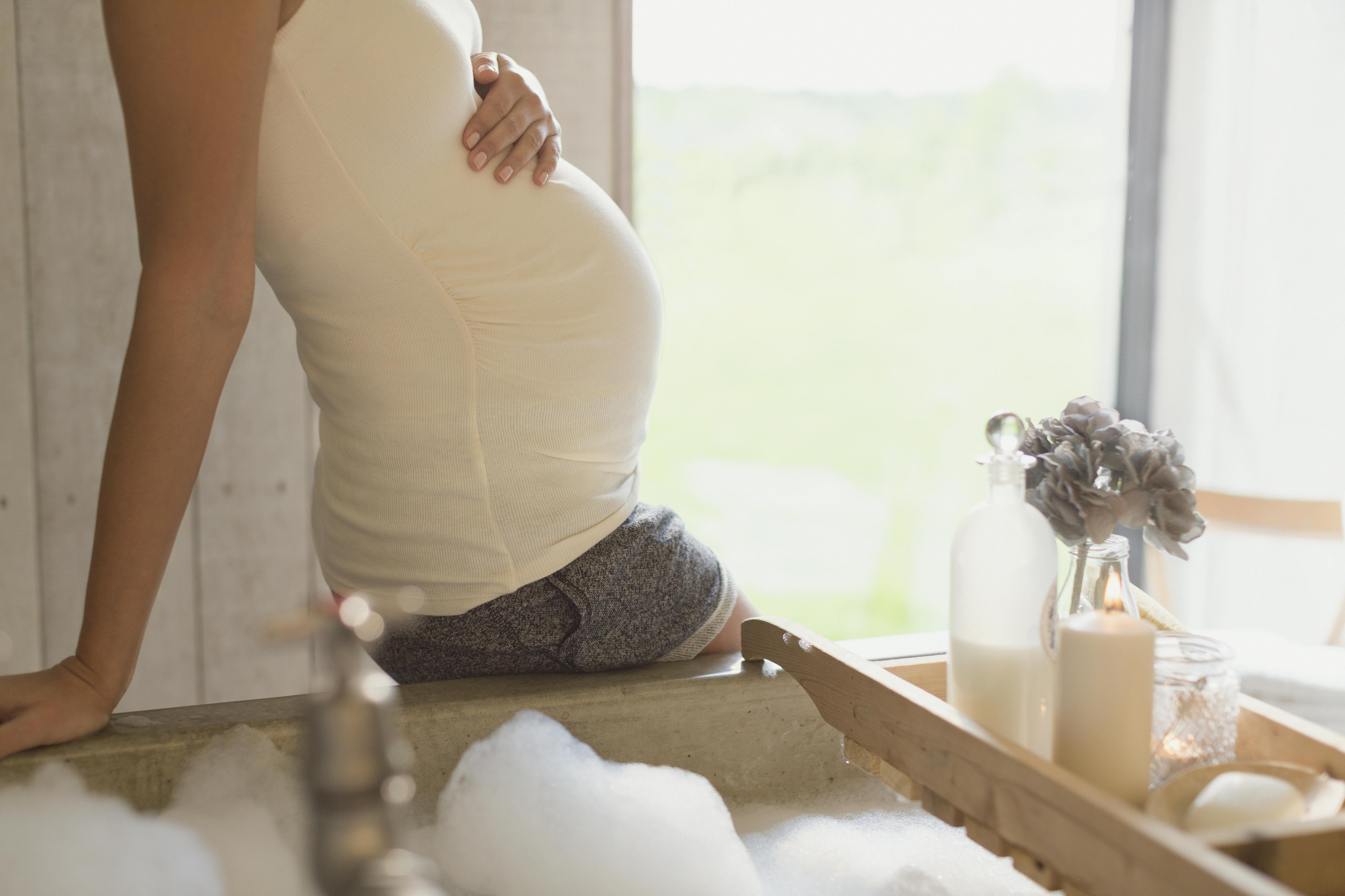 Pregnant woman with visible tattoo