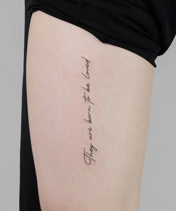 Quote front thigh tattoo for women
