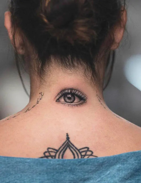 Realism eye tattoo behind the neck by @tatu_panda