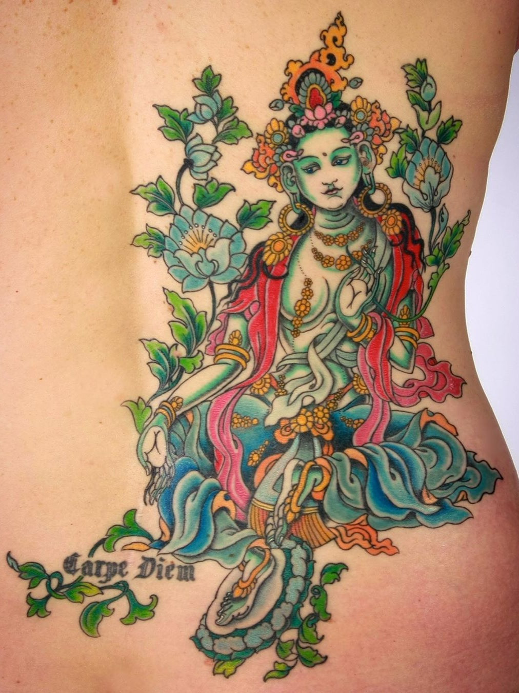 A female bodhisattva tattoo by Yoni Zilber