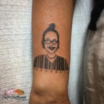 Barcode tattoo on the arm with meaningful numbers
