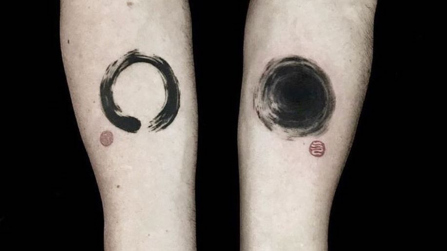 An enso tattoo in black ink