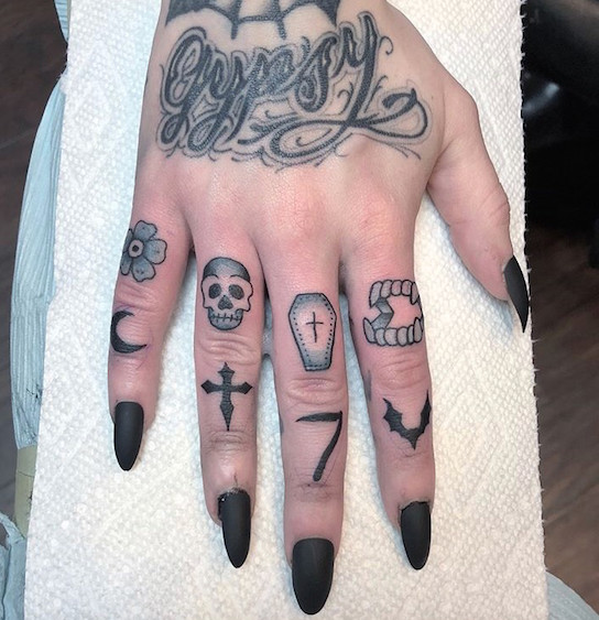 Finger tattoos by Krista Olofsson