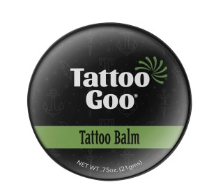 Tattoo Goo Tattoo Balm in a travel-friendly container is great for maintaining tattoo vibrancy.