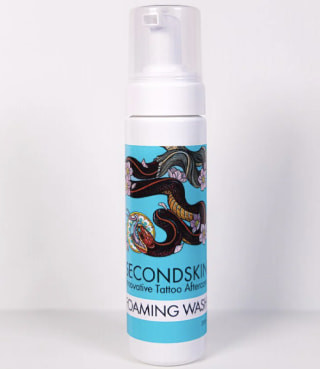 SecondSkin Foaming Tattoo Wash provides antimicrobial cleaning with natural ingredients.