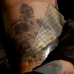 Tattoo artist wearing gloves