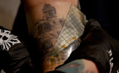 Tattoo artist wearing gloves