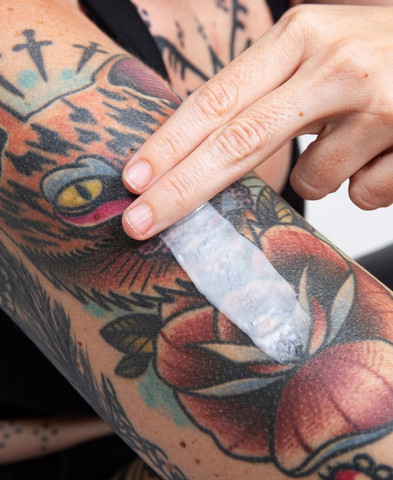 Peeling tattoo on arm